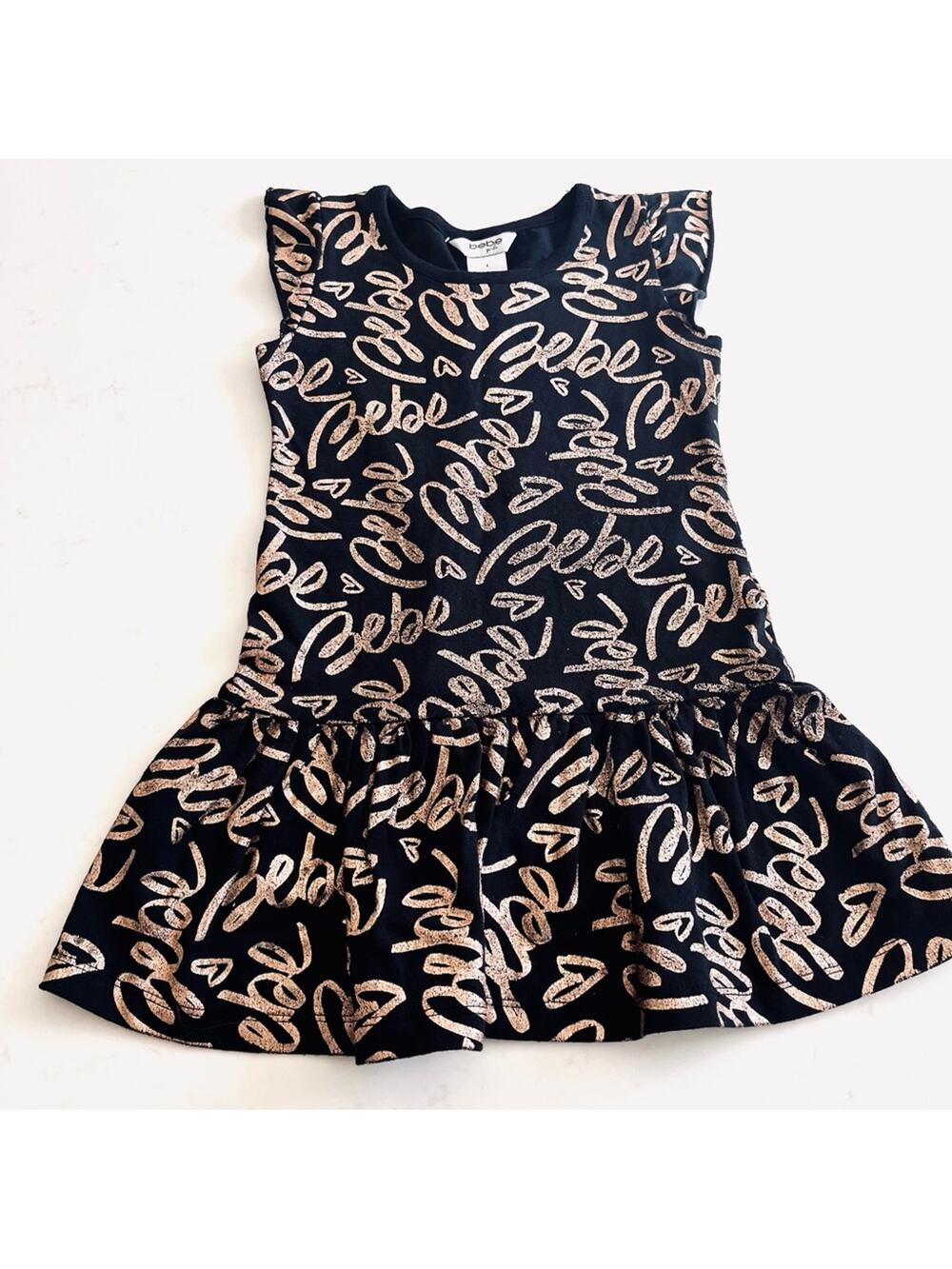 Bebe girls black jersey dress with gold Bebe words throughout size 4